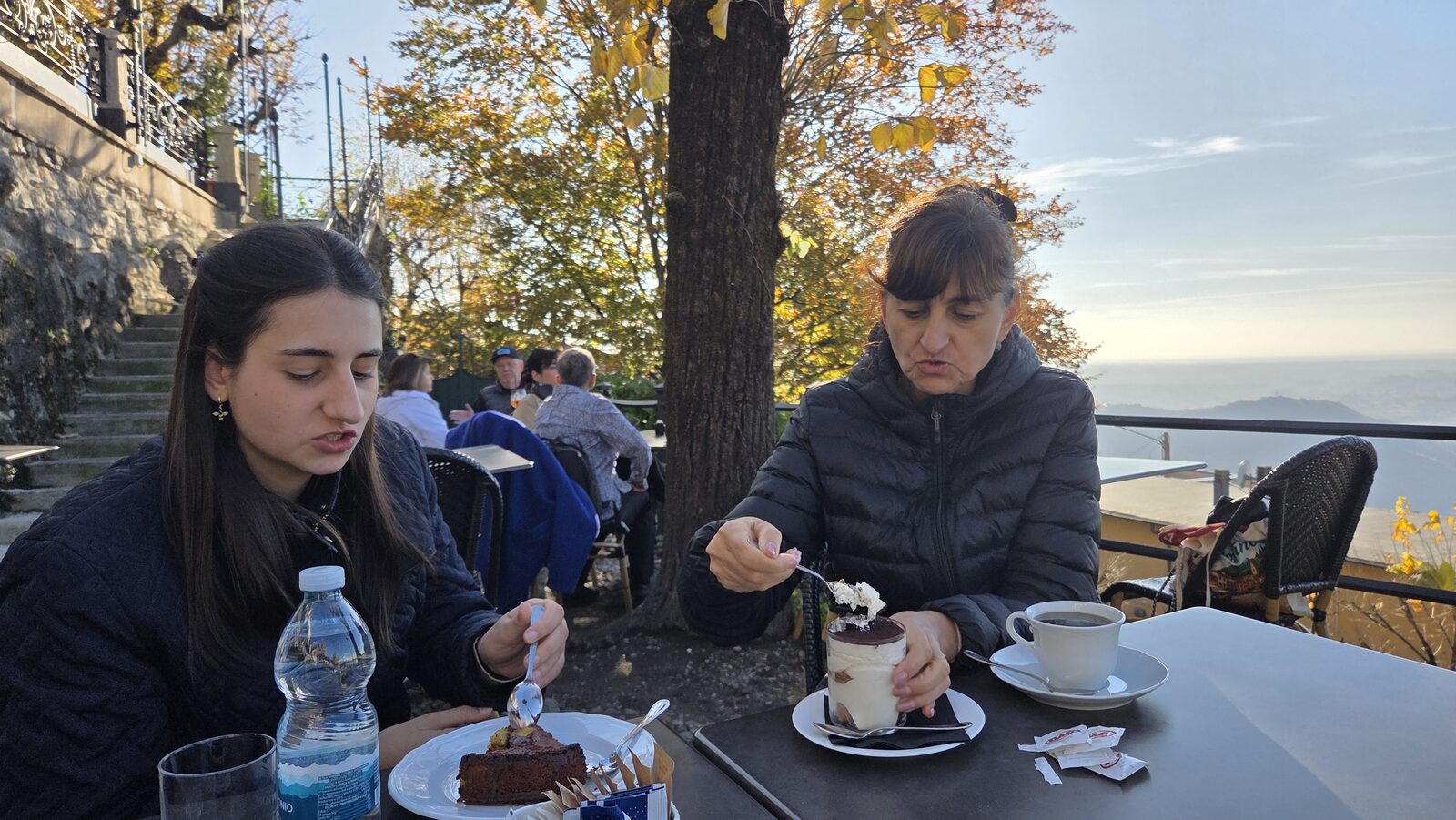 Maritza and Albena over dessert above the lake
