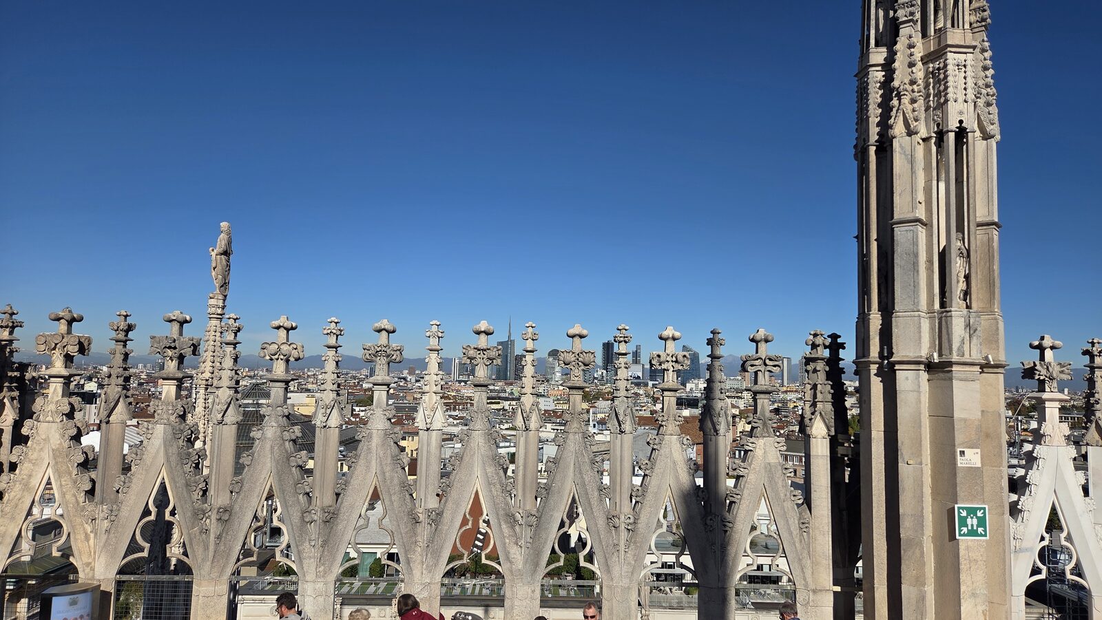 Gothic spires with the modern skyline behind