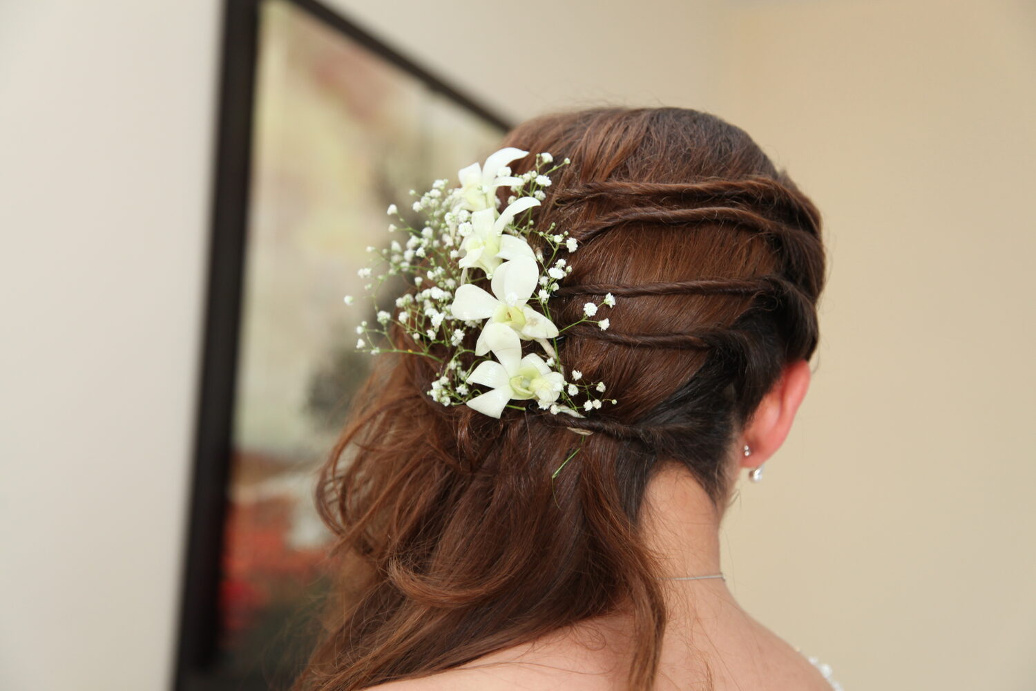 The bride's hair pinned with gypsophila