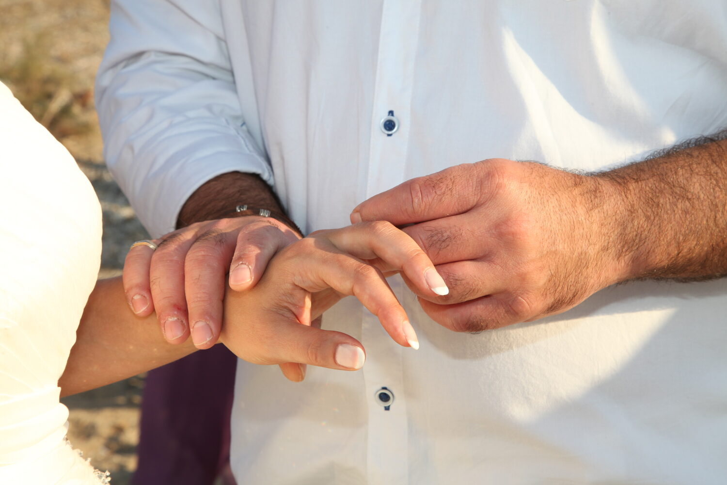 Hands exchanging rings