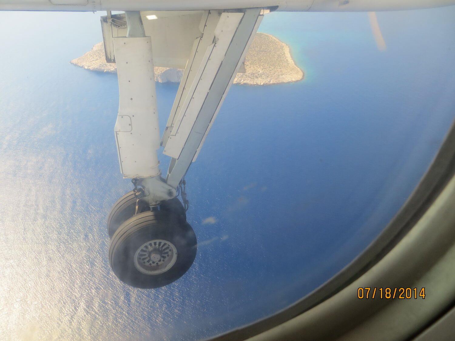 The wing of the plane over the Aegean
