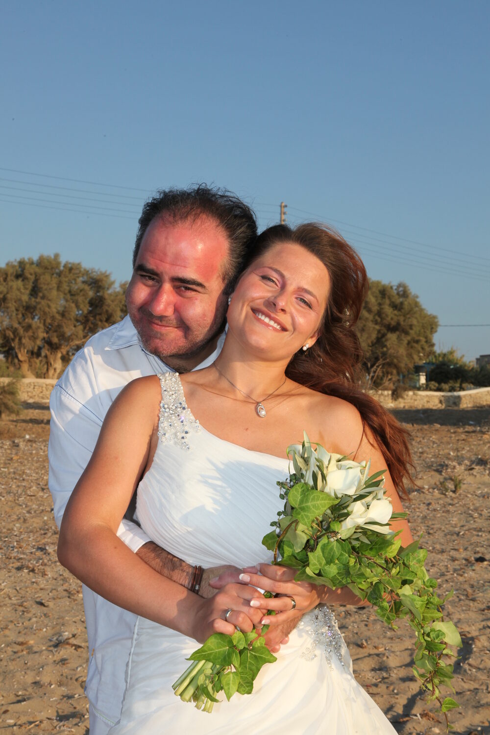 The bride and groom embracing