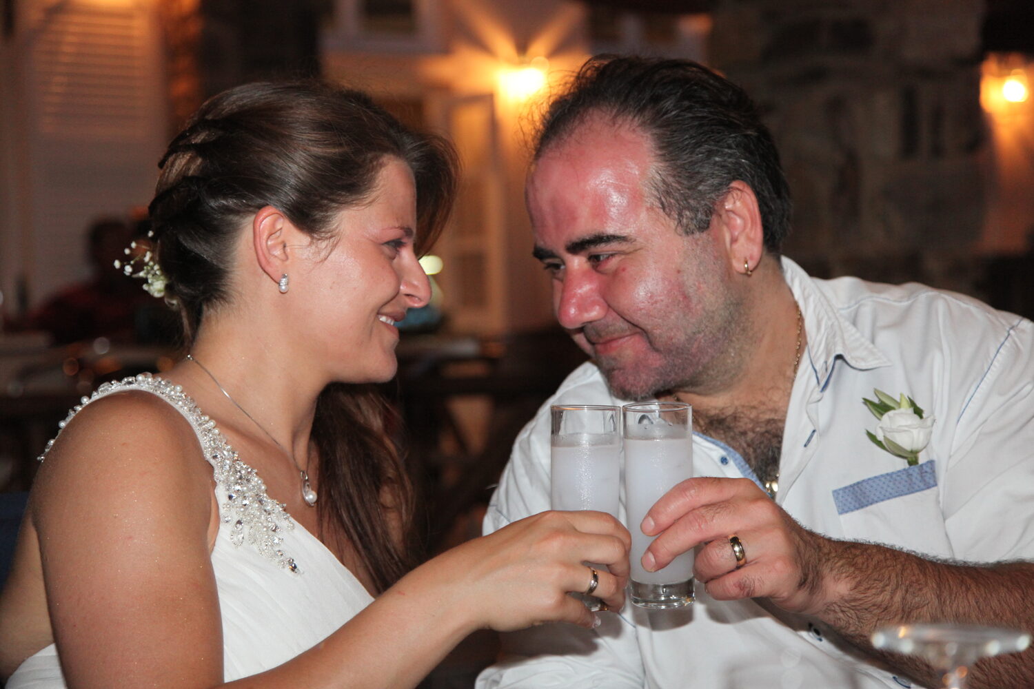 The couple with glasses of ouzo