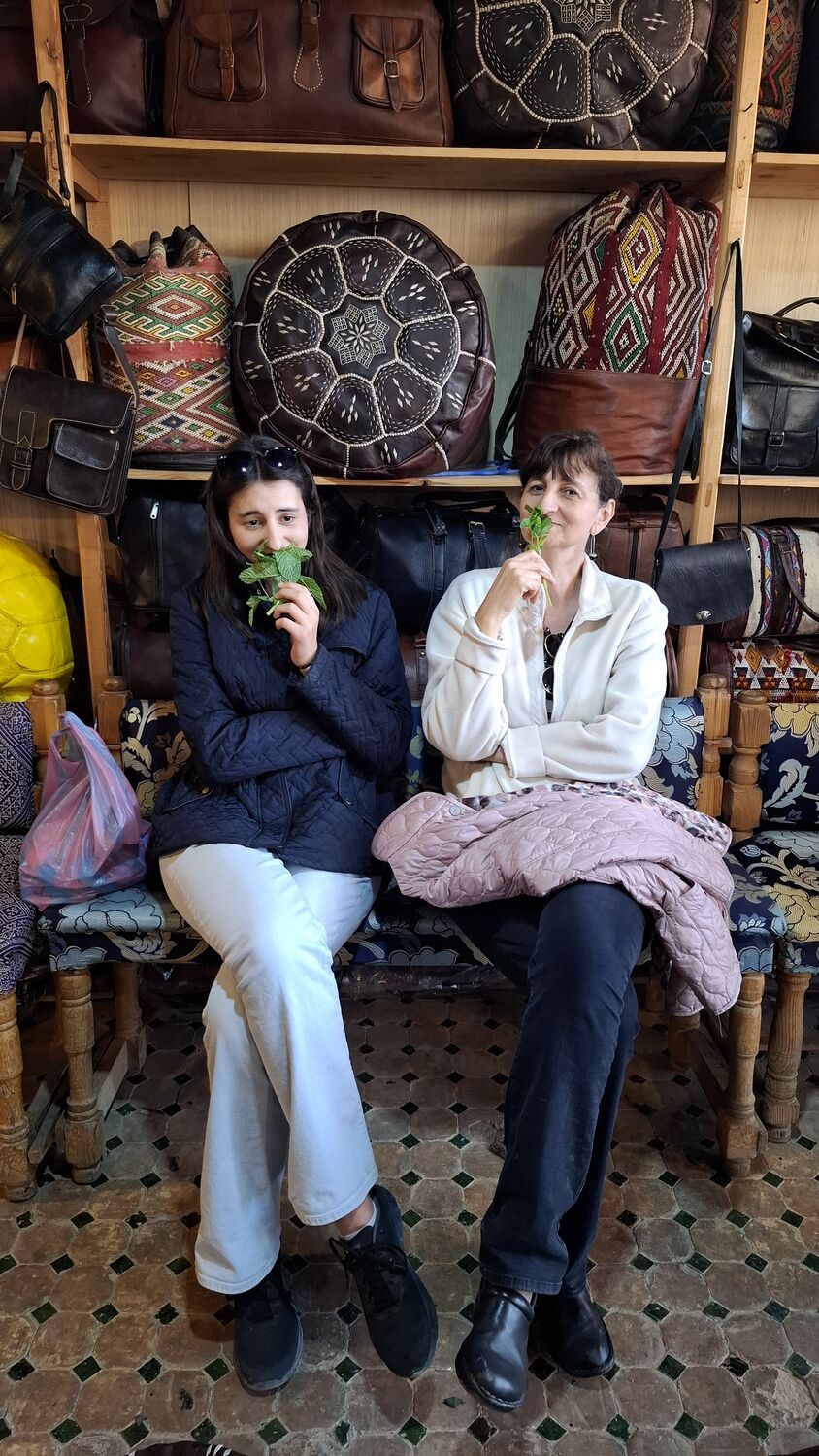 Albena and Maritza holding mint to their noses
