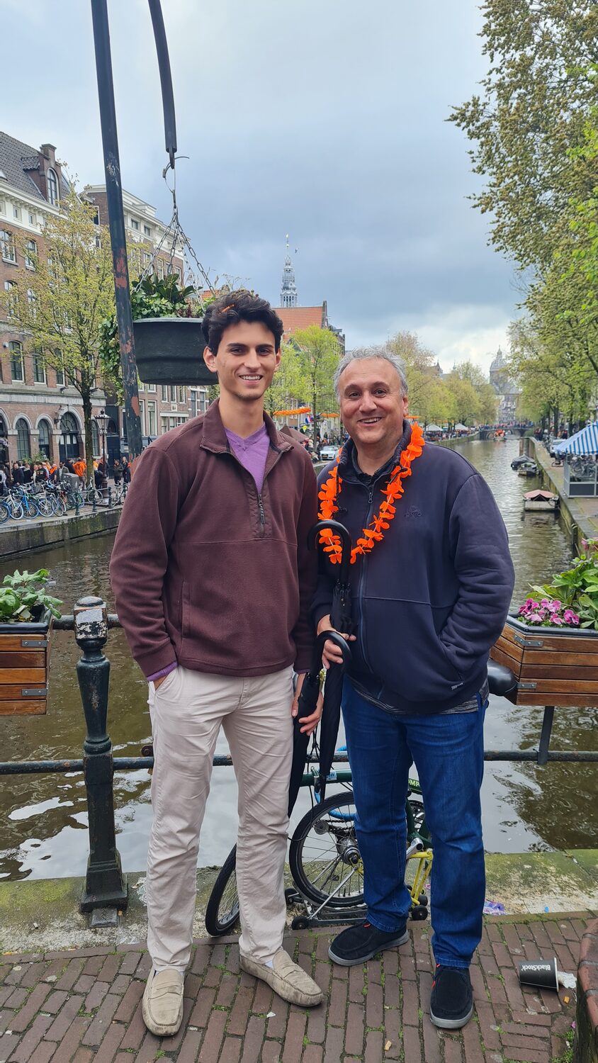 Alex and Plamen in orange garlands