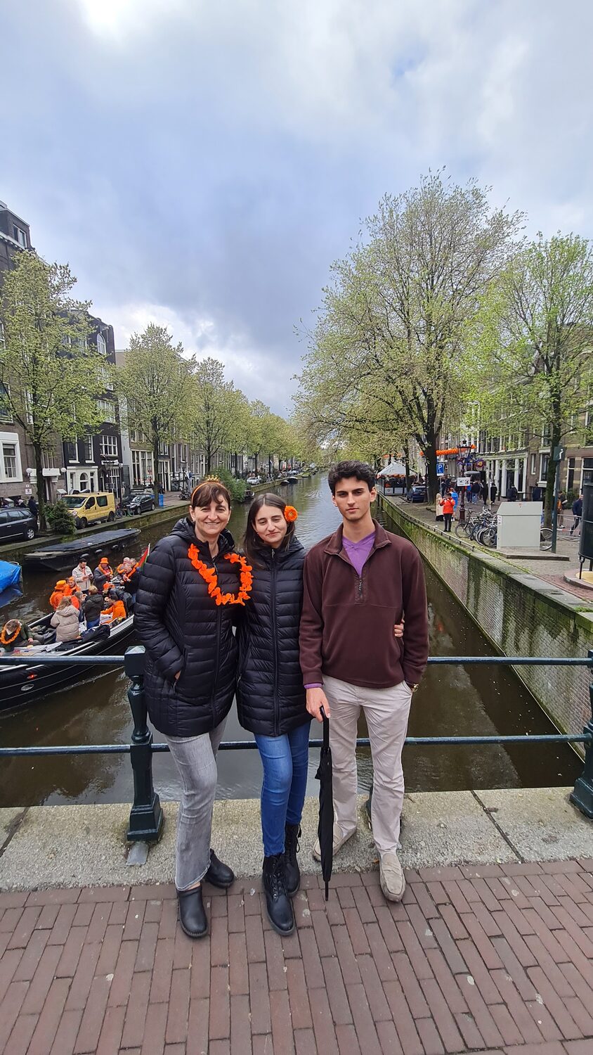 The family walking along a canal