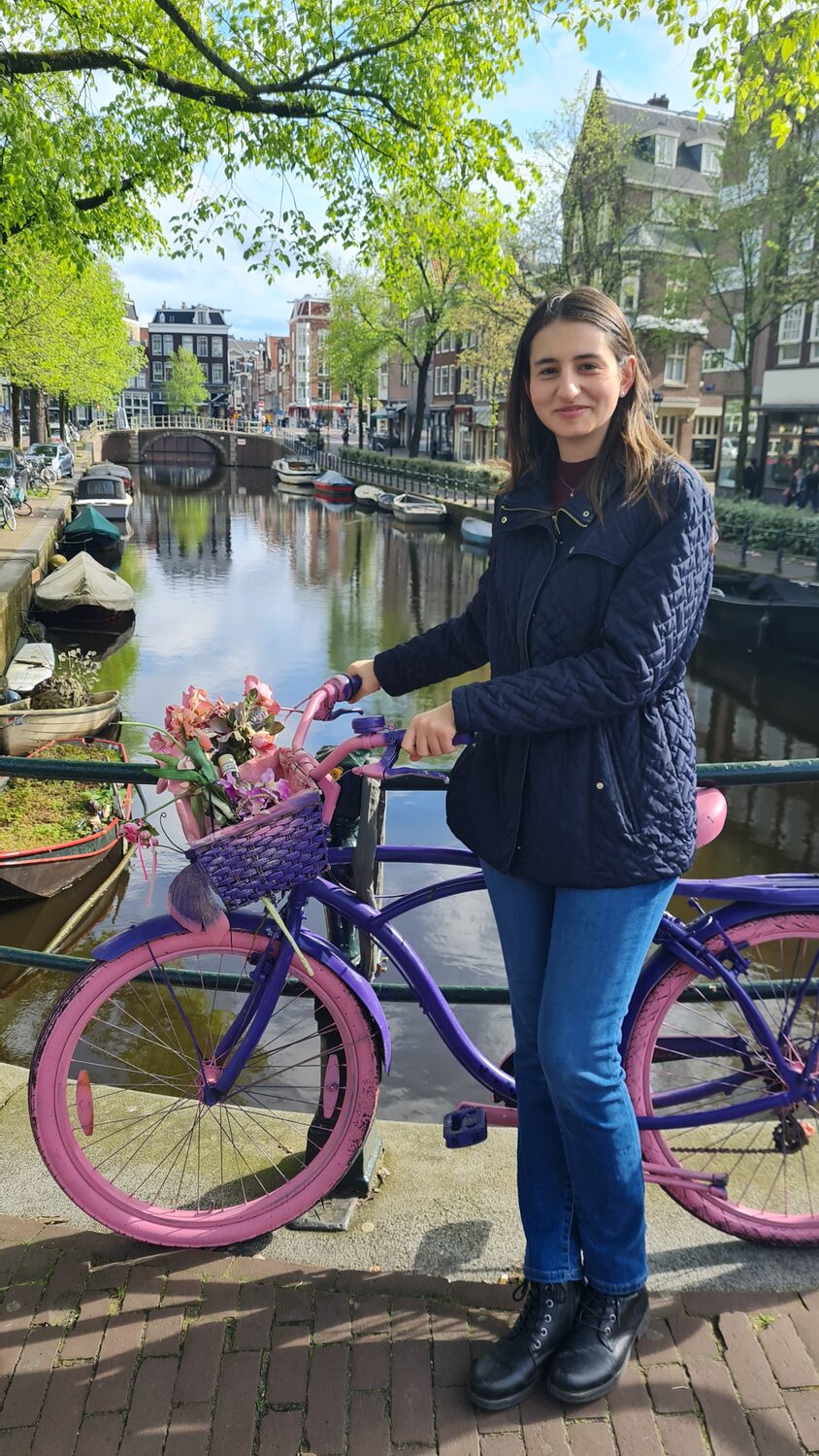 Maritza beside a decorated bicycle