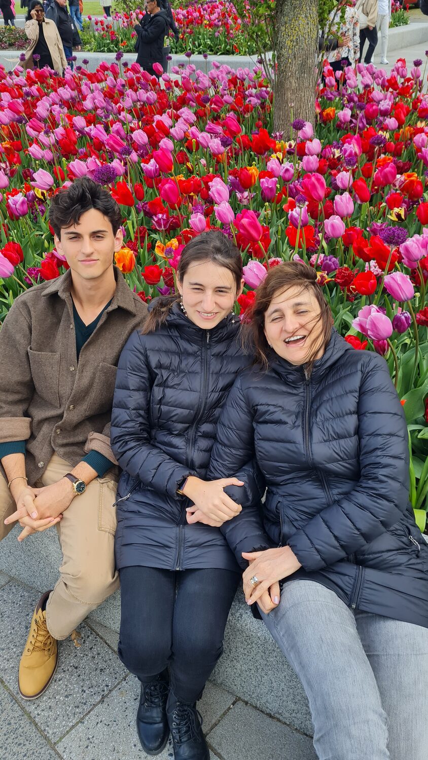 The family sitting among the tulips