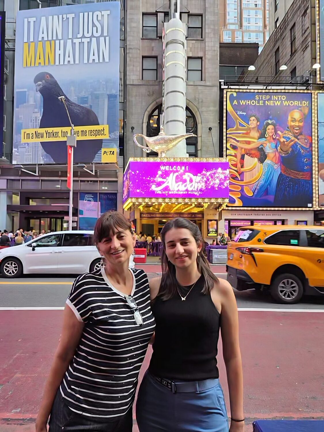Albena and Maritza under a Broadway marquee