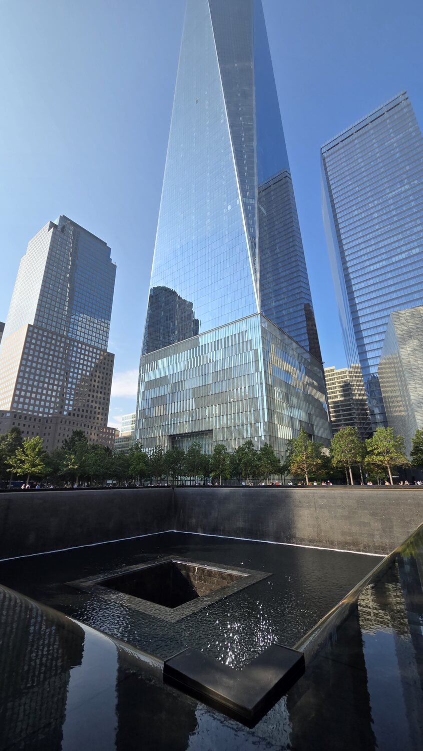 The memorial pool with One World Trade Center behind