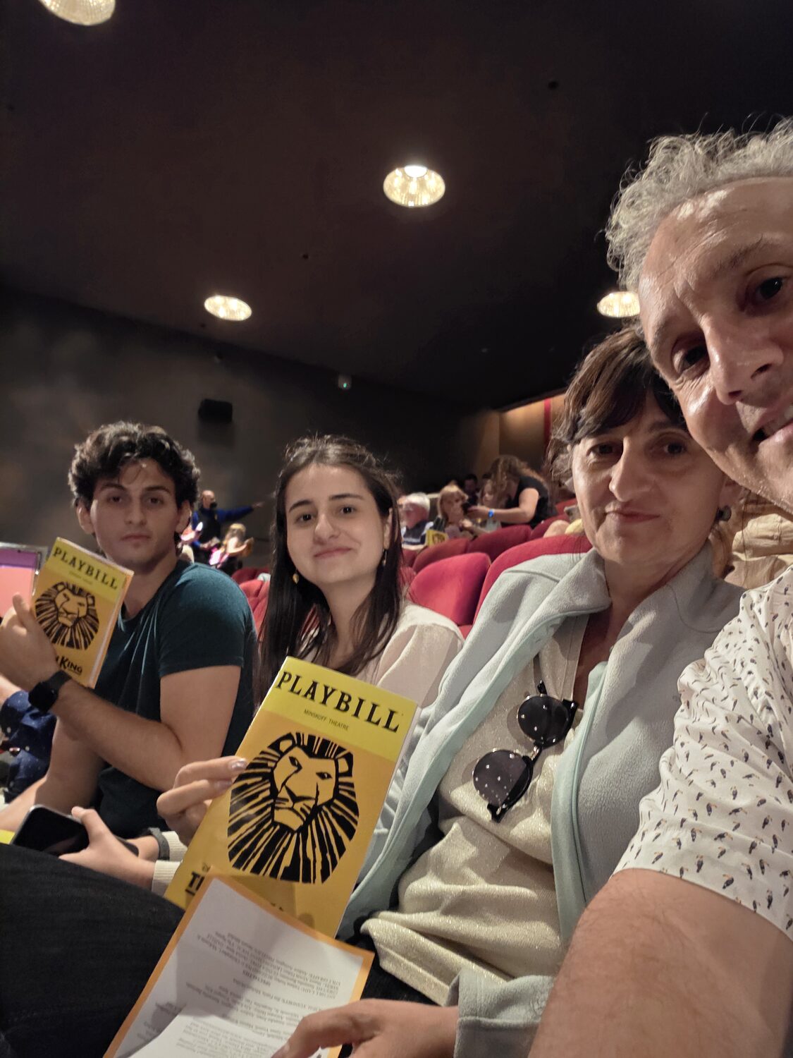 The family with Playbills before the show