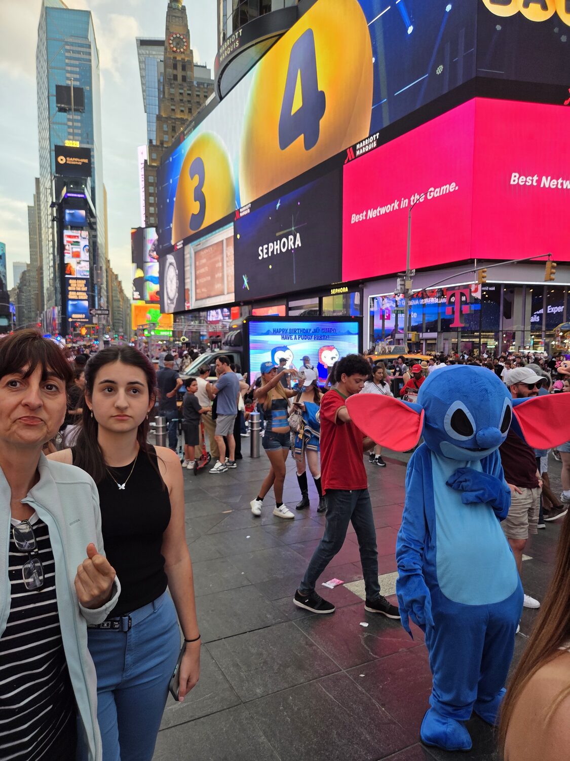 Maritza with a costumed character in Times Square